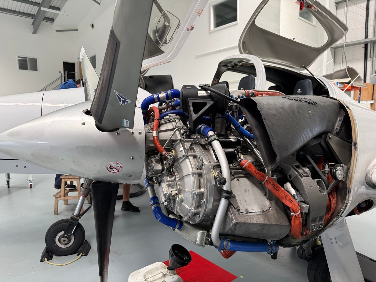 Diamond aircraft undergoing maintenance with the engine cowling removed