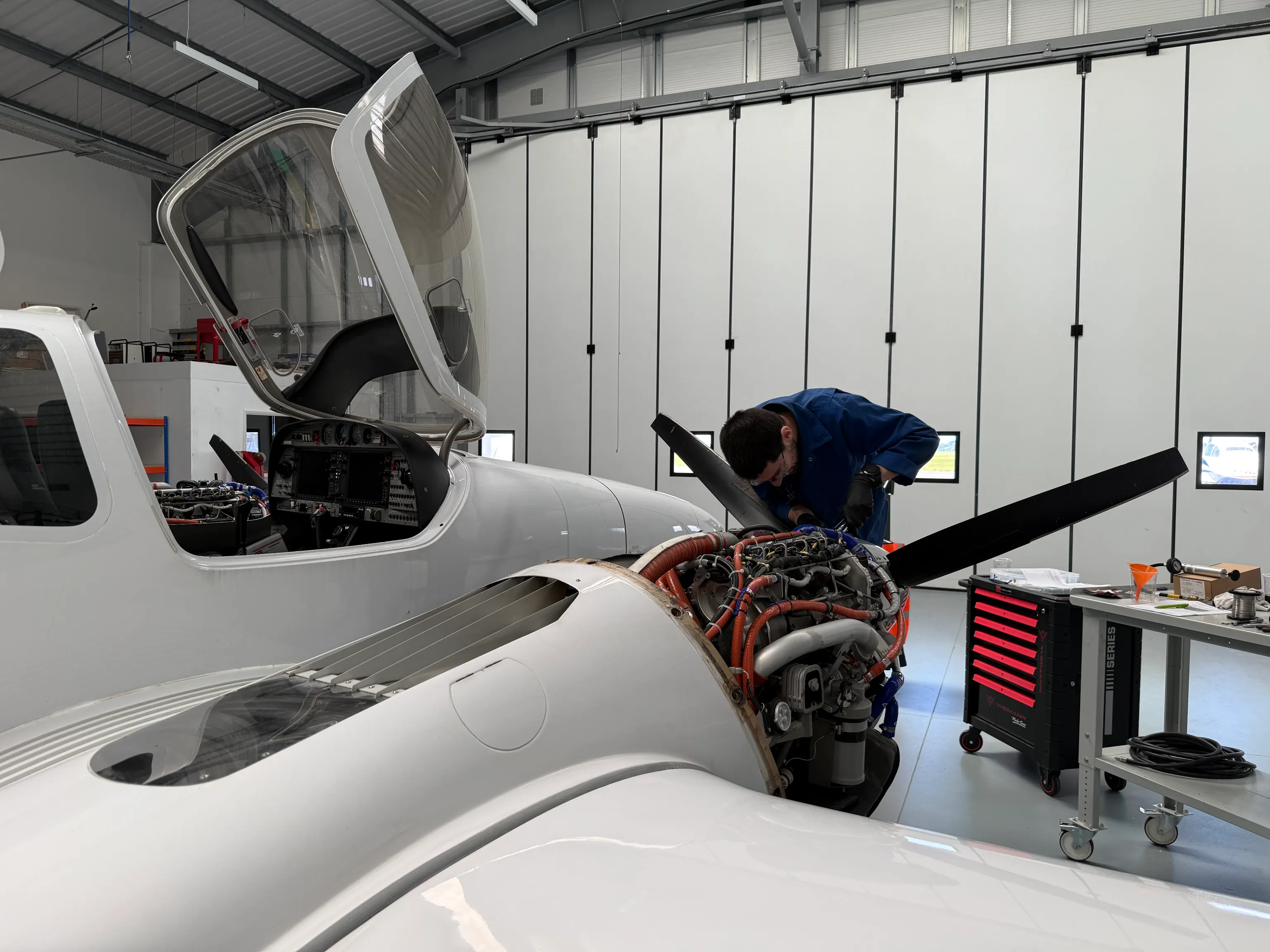 An EFM engineer working on a Diamond DA42 engine